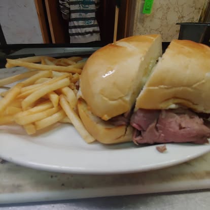 Prime Rib French Dip sandwich served with au jus at Murry's Place